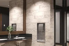Thumbnail for Modern restroom with dual sinks, large mirror, hand dryer, and beige tiled walls and floor.