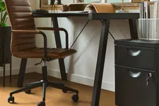 Thumbnail for Modern home office setup with brown leather chair, black desk, computer, and large window with natural light