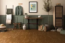 Thumbnail for Cozy room with cork flooring, green paneled wall, rustic bench, potted plant, and woven basket with decor.