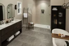 Thumbnail for Modern bathroom with double vanity, walk-in shower, freestanding tub, and neutral tones with sleek finishes