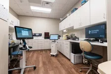 Thumbnail for Modern dental lab with digital equipment, workstations, and wooden flooring in a clean, organized setting