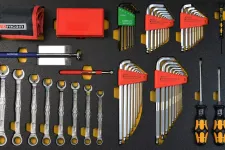 Thumbnail for Organized set of wrenches, hex keys, and screwdrivers with black and orange handles on foam board.