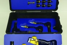 Thumbnail for Open black case with blue foam inserts holding multiple pneumatic tools and metal fittings.
