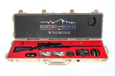 Thumbnail for Rifle in custom case with red lining and Hunting with Heroes Wyoming logo on lid interior.