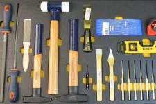 Thumbnail for Set of woodworking and measuring tools including chisels, hammers, files, tape measure, level, and magnetic parts tray.