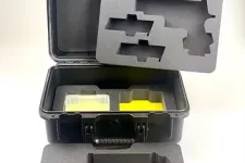 Thumbnail for Black protective case with custom foam inserts designed to hold specific tools or equipment securely.