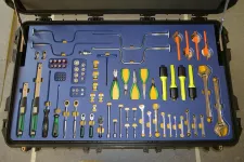 Thumbnail for Organized tool case with various hand tools including pliers, screwdrivers, wrenches, and specialized metal tools.