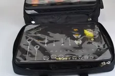 Thumbnail for Black tool case with transparent covers displaying assorted hand tools like wrenches and screwdrivers organized inside.