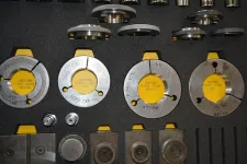 Thumbnail for Set of precision metal gauge rings and measuring tools neatly arranged in a tool case.