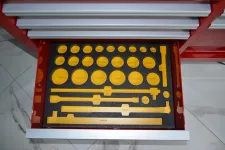 Thumbnail for Open drawer with yellow plastic profile gauges organized in black foam for measurement and inspection tasks.
