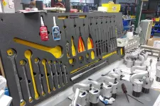 Thumbnail for Organized workshop bench with various wrenches, hand tools, and piping equipment neatly arranged on foam board.