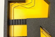 Thumbnail for Black foam insert with yellow background holding metallic rods with black plastic ends in each slot.
