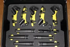 Thumbnail for Black and yellow drum microphone clamps and eight black drum microphones in a protective foam case.