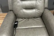 Thumbnail for a leather chair with a remote control