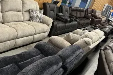 Thumbnail for a couch with a black bag on it