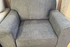 Thumbnail for a grey chair with a cushion