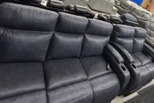 Thumbnail for a pile of black leather chairs