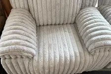 Thumbnail for a grey couch with a cushion