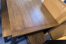 Thumbnail for a wooden table with a box on top