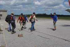 Thumbnail for a group of people standing on a runway