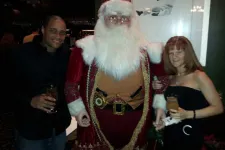 Thumbnail for people posing with Santa