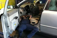 Thumbnail for a man working inside of a car