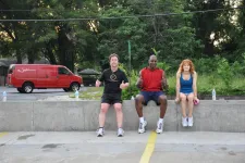 Thumbnail for a group of people sitting in a parking lot