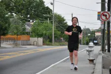 Thumbnail for Craig running on a sidewalk