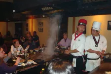 Thumbnail for a group of people sitting at a hibachi grill