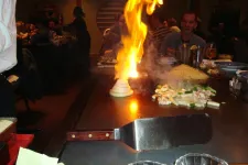Thumbnail for people sitting at a hibachi grill
