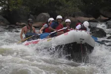 Thumbnail for a group of people riding a river raft