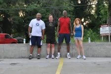 Thumbnail for a group of people standing in a parking lot
