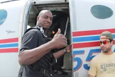 Thumbnail for a man standing in front of a plane