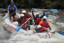 Thumbnail for a group of people riding on a raft