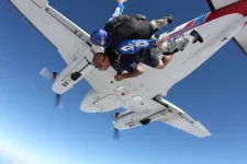Thumbnail for two people jumping out of a plane