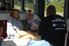 Thumbnail for a group of people sitting on a bus