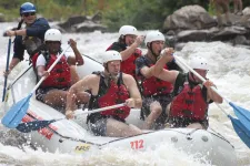 Thumbnail for a group of people on a raft in rapids
