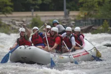 Thumbnail for a group of people riding on a raft