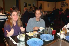 Thumbnail for a group of people sitting at a table in a restaurant