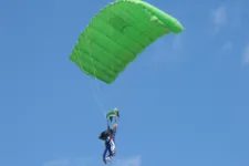 Thumbnail for two people under a parachute