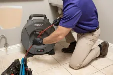 Thumbnail for a man using a vacuum cleaner
