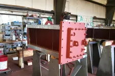 Thumbnail for a large red machine in a factory