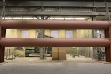 Thumbnail for a large metal pipe in a warehouse