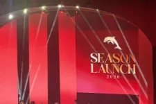 Thumbnail for Group of men in blue blazers standing on stage at Season Launch 2026 event with red background and dolphin logo.
