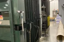 Thumbnail for Industrial machinery and equipment lined up in a warehouse with concrete flooring and overhead lighting.