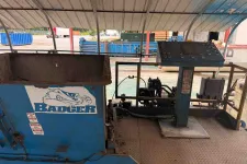 Thumbnail for Blue industrial Badger machine with control panel under metal roof at outdoor worksite.