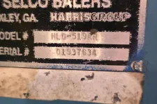 Thumbnail for Close-up of Selco Balers metal identification plate with model HL0-519AR and serial number 01937634.