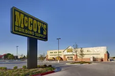Thumbnail for McCoy's Building Supply store and large outdoor sign under clear blue sky in spacious parking lot.