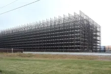 Thumbnail for Large industrial metal rack storage structure outdoors with multiple levels and open framework