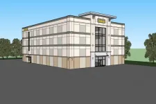 Thumbnail for Modern three-story storage facility building with large windows and surrounding trees under a clear sky.